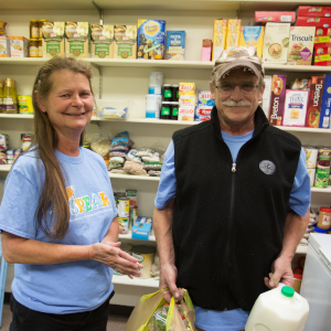 300 x 300 client receiving milk and other food items at a food pantry
